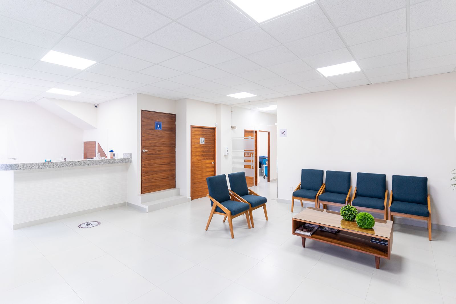 The waiting room and check-in desk of a modern dental clinic